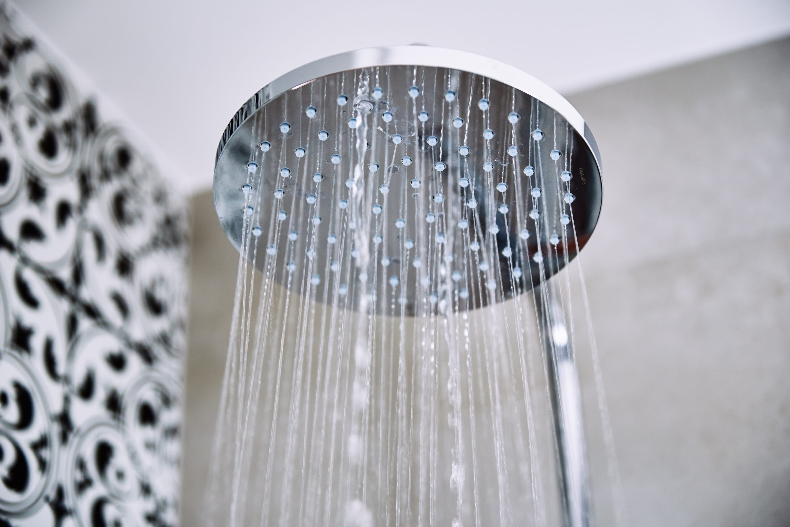 Clean water flowing from a modern shower