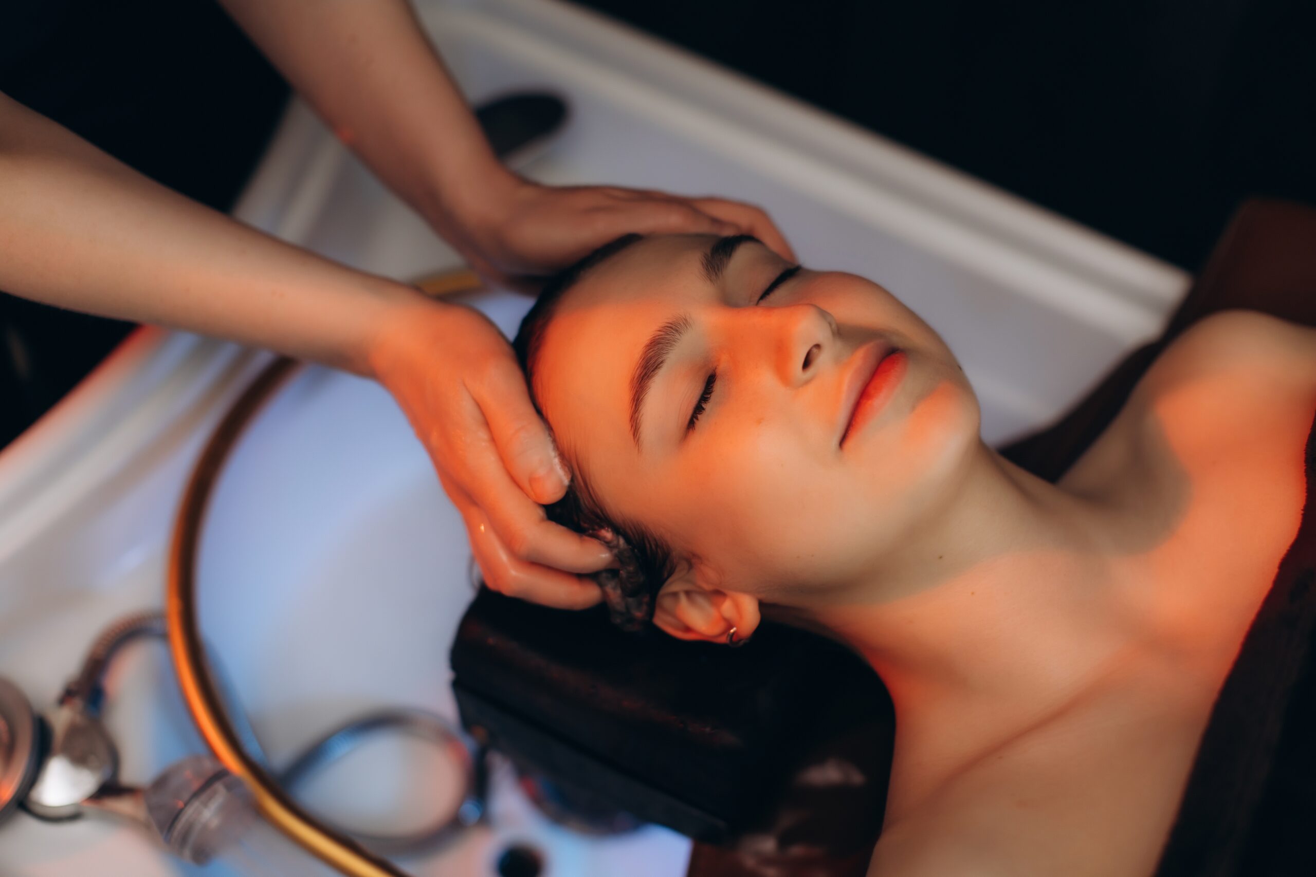 Client receiving a professional head spa treatment